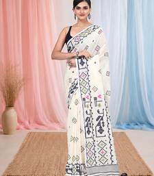 off white cotton blend saree with traditional woven patterns and tassel border