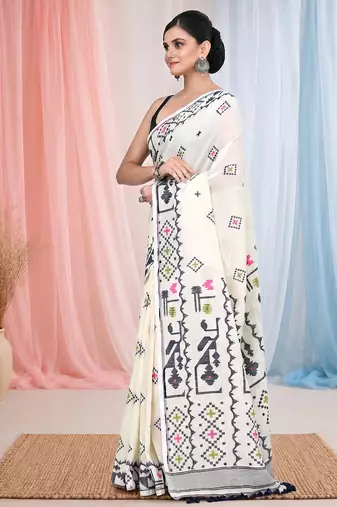 off white cotton blend saree with traditional woven patterns and tassel border