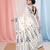 off white cotton blend saree with traditional woven patterns and tassel border