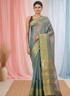 Elegant teal tissue saree with contrasting golden border 1