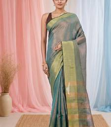 Elegant teal tissue saree with contrasting golden border