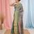 Elegant teal tissue saree with contrasting golden border