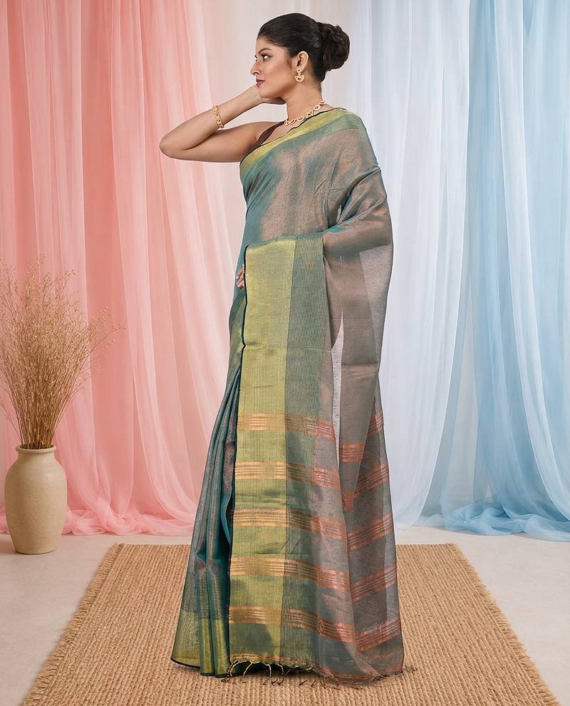Elegant teal tissue saree with contrasting golden border