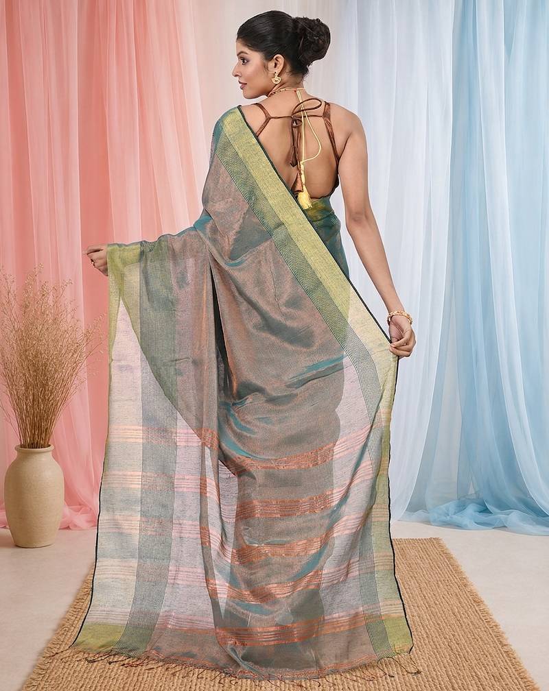 Elegant teal tissue saree with contrasting golden border