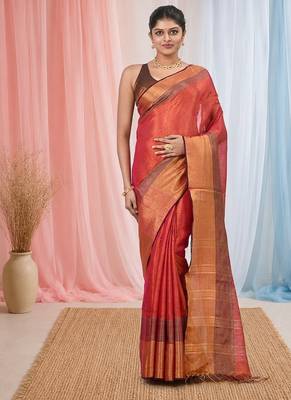 Elegant red tissue saree with contrasting golden border 1