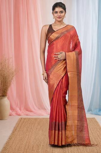 Elegant red tissue saree with contrasting golden border