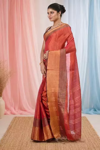Elegant red tissue saree with contrasting golden border