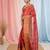 Elegant red tissue saree with contrasting golden border