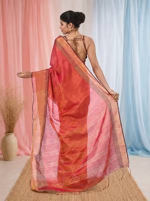 Elegant red tissue saree with contrasting golden border 3