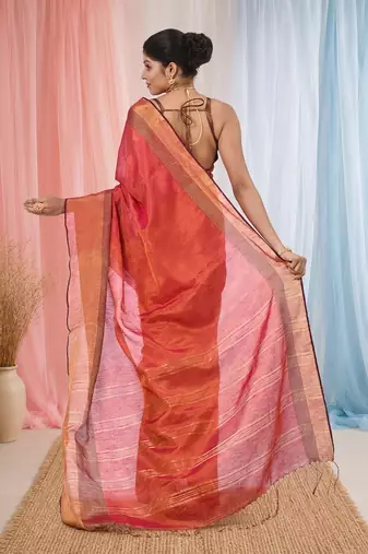 Elegant red tissue saree with contrasting golden border