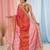 Elegant red tissue saree with contrasting golden border