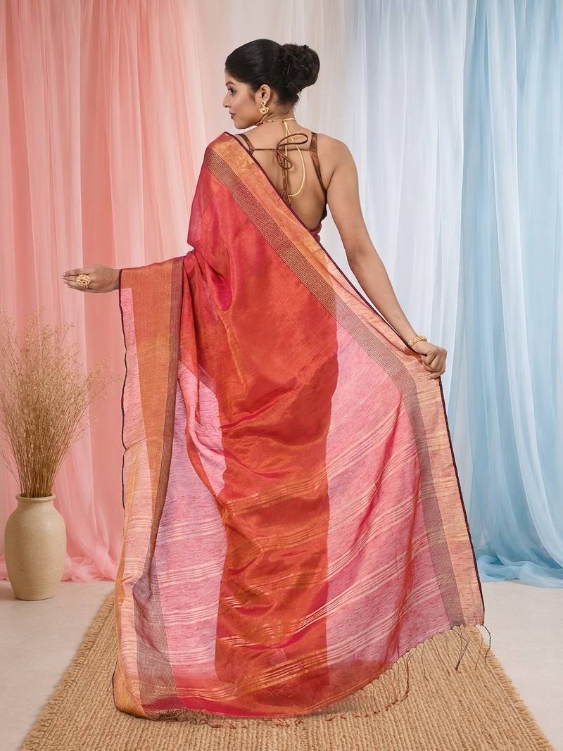 Elegant red tissue saree with contrasting golden border