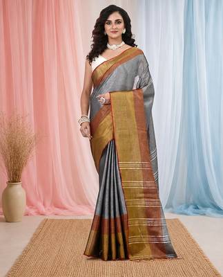 Elegant grey tissue saree with contrasting golden border 1
