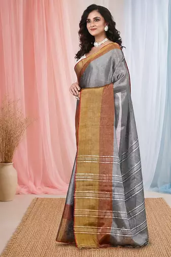 Elegant grey tissue saree with contrasting golden border
