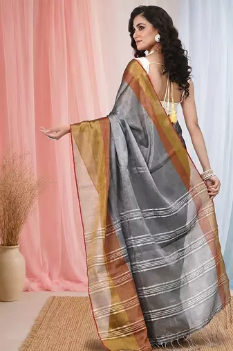 Elegant grey tissue saree with contrasting golden border