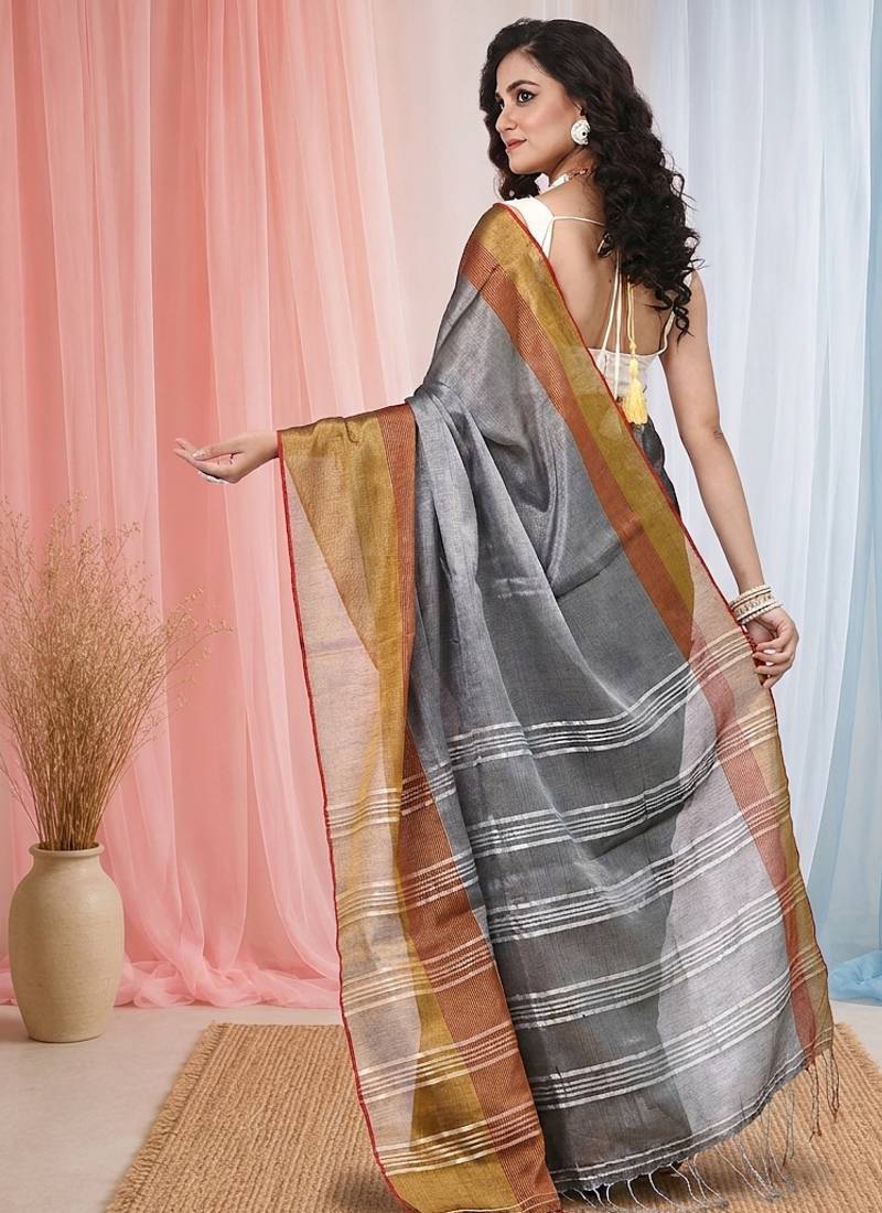 Elegant grey tissue saree with contrasting golden border
