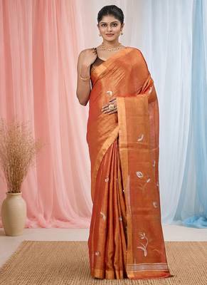 Orange tissue saree with ethnic motifs and golden border 1
