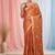 Orange tissue saree with ethnic motifs and golden border