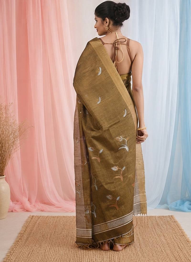 Metallic tissue saree with ethnic motifs and golden border