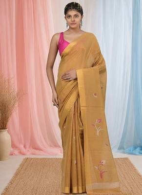 Beige tissue saree with ethnic motifs and golden border 1