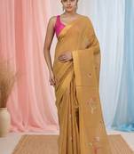 Beige tissue saree with ethnic motifs and golden border