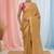 Beige tissue saree with ethnic motifs and golden border