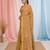 Beige tissue saree with ethnic motifs and golden border