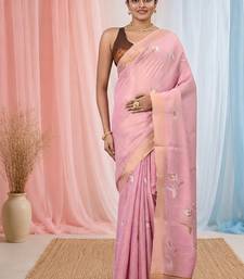 Baby pink tissue saree with ethnic motifs and golden border