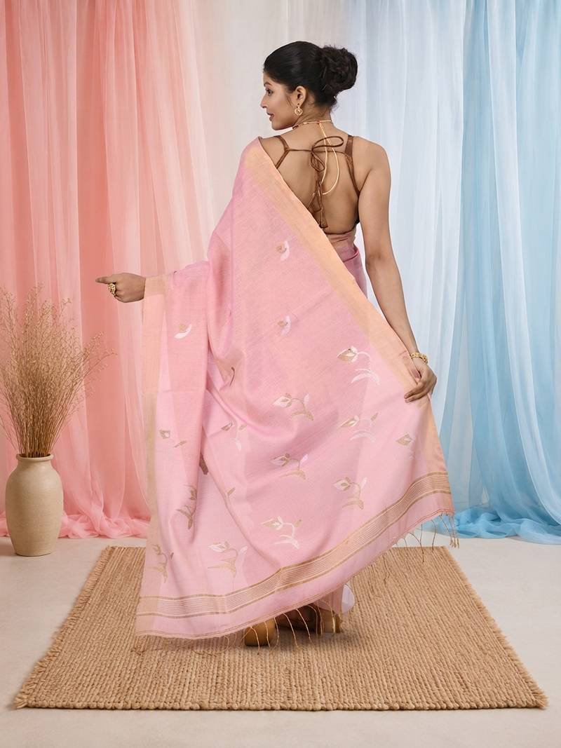 Baby pink tissue saree with ethnic motifs and golden border