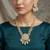 Gold-plated pearl beaded kundan style jewellery set with necklace & earrings
