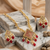 Gold-plated maroon kundan studded pearl cluster long thewa necklace & earrings set