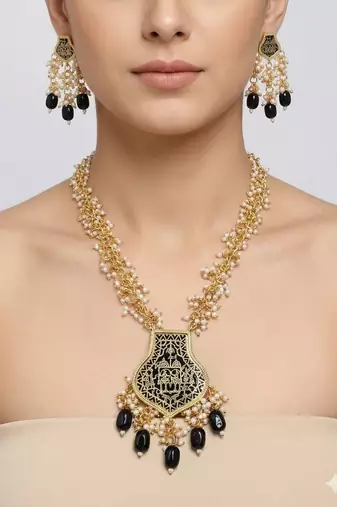 Gold-toned black beaded long necklace set with enamel thewa pendant and earrings