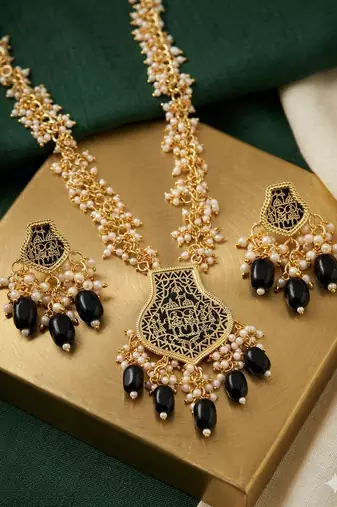 Gold-toned black beaded long necklace set with enamel thewa pendant and earrings