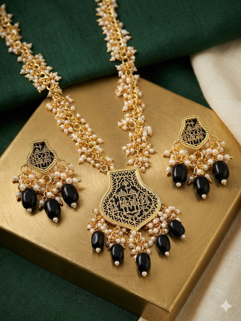 Gold-toned black beaded long necklace set with enamel thewa pendant and earrings