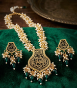 Gold-toned green pearl beaded thewa jewellery set with earrings
