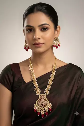 Gold-toned pearl beaded temple jewellery set with maroon stone pendant & earrings