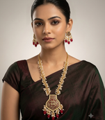 Gold-toned pearl beaded temple jewellery set with maroon stone pendant & earrings