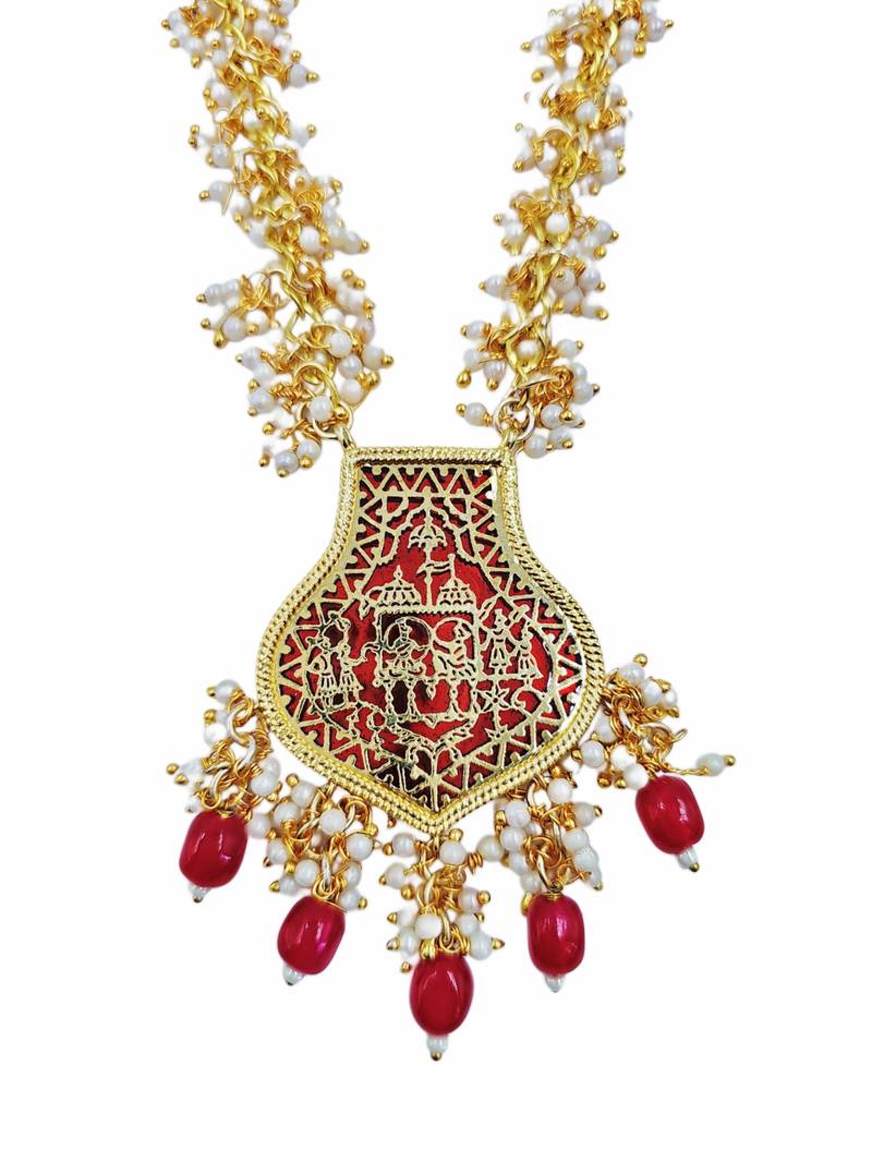 Gold-toned pearl beaded temple jewellery set with maroon stone pendant & earrings