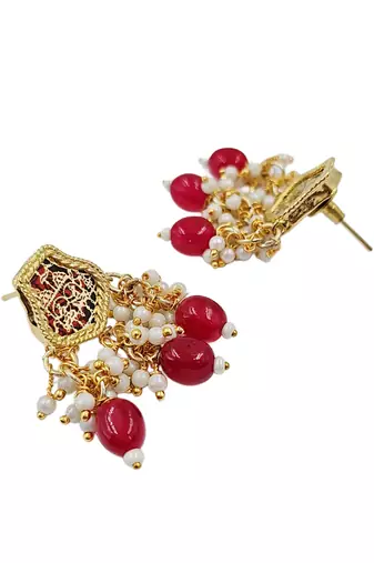 Gold-toned pearl beaded temple jewellery set with maroon stone pendant & earrings