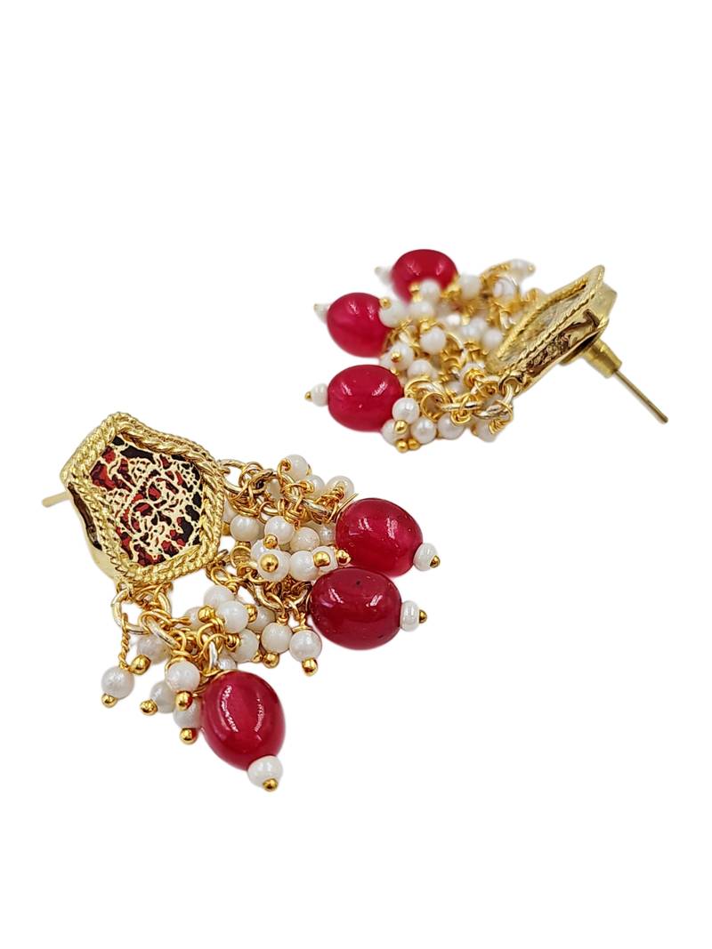 Gold-toned pearl beaded temple jewellery set with maroon stone pendant & earrings