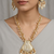 Gold-toned & white pearl-beaded temple jewellery necklace & earrings set