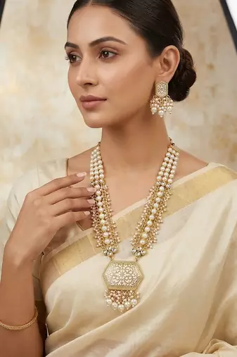 Antique gold-toned kundan pearl cluster necklace set with hexagonal meenakari pendant and pearl jhumka earrings