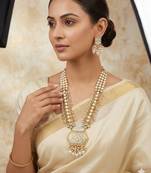 Antique gold-toned kundan pearl cluster necklace set with hexagonal meenakari pendant and pearl jhumka earrings