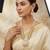 Antique gold-toned kundan pearl cluster necklace set with hexagonal meenakari pendant and pearl jhumka earrings