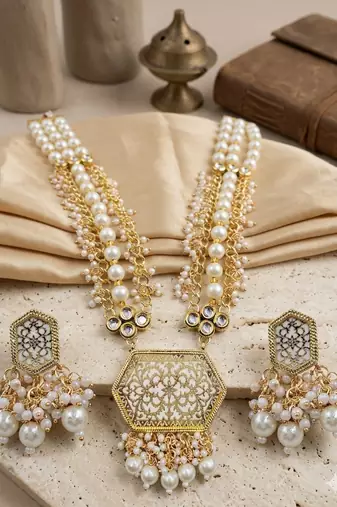 Antique gold-toned kundan pearl cluster necklace set with hexagonal meenakari pendant and pearl jhumka earrings