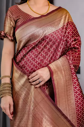 Maroon elegant zari woven banarasi silk sarees with attached blouse