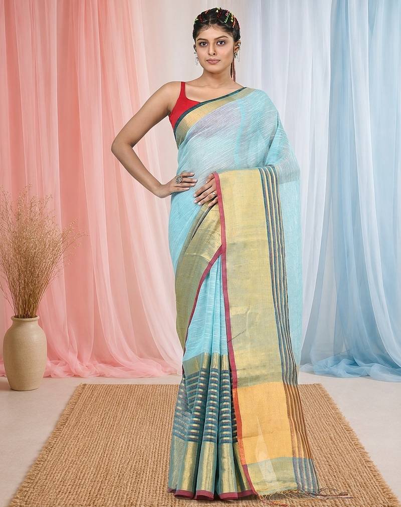 Elegant sky blue and gold linen saree with striped borders