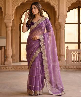 lavender color embroidery sequence work heavy border with buttis satin saree 1