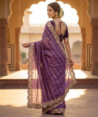 lavender color embroidery sequence work heavy border with buttis satin saree 5