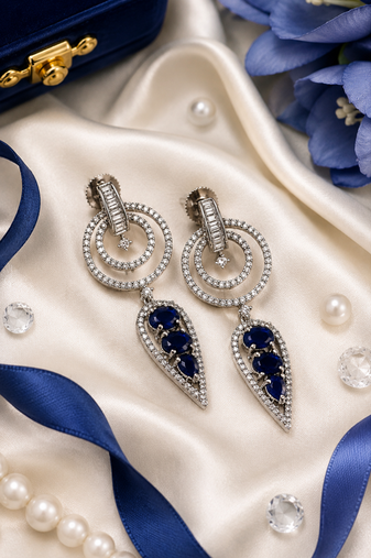 Rhodium finish sapphire halo drop earrings